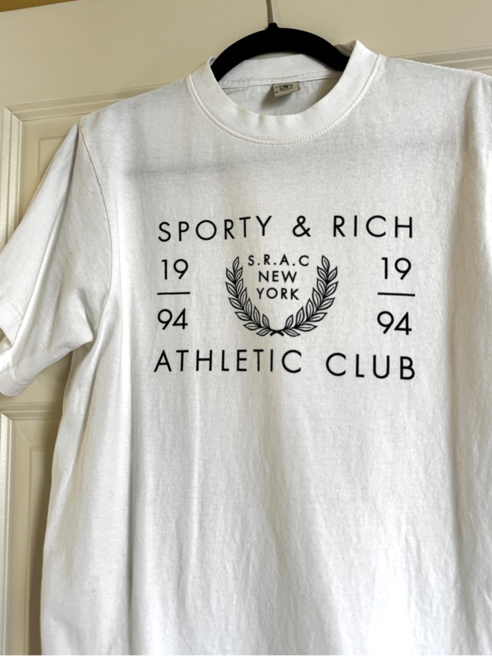 Sporty & Rich White Tee with Black Neck Logo